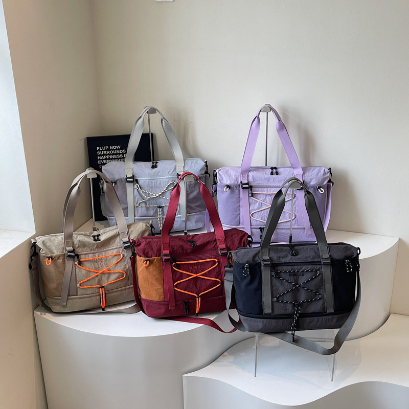 户外轻便尼龙面料防水手提单肩行李袋大容量斜挎单肩包短途旅行包